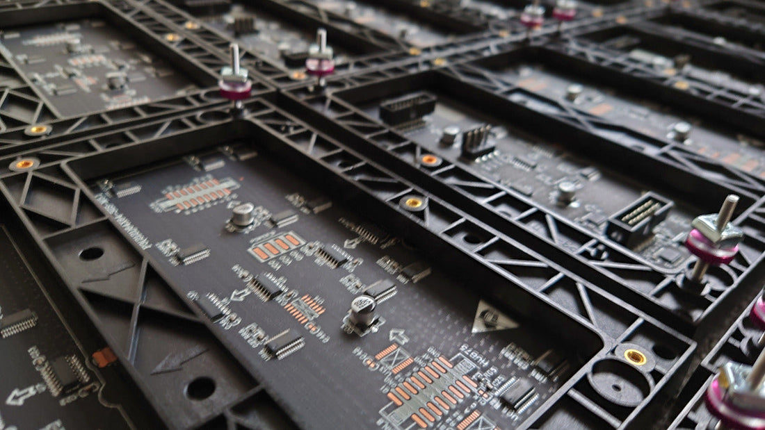 Close up of the an LED module back showing the support frame, circuit, components