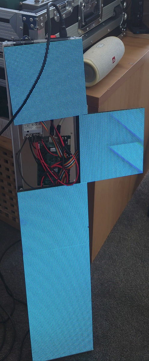 Blue LED matrix with circuit board, wiring, and power supply visible