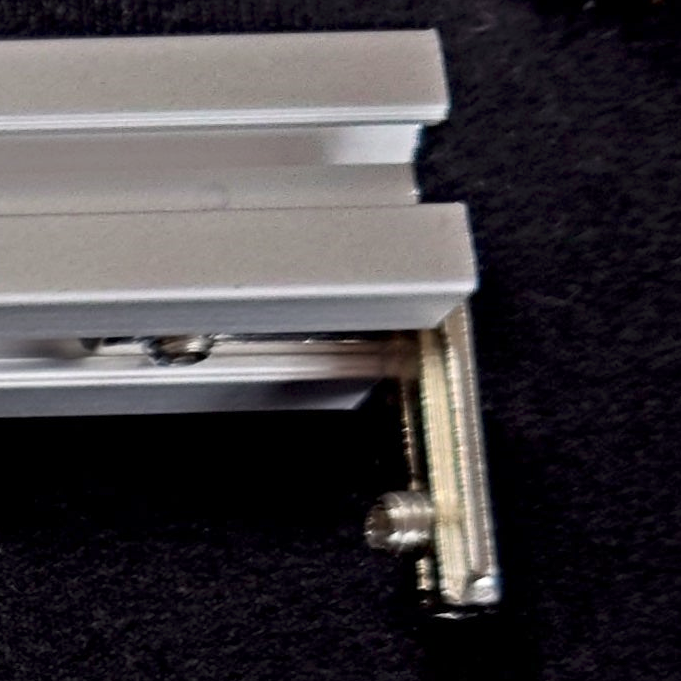 When aligned correctly the L-bracket wills be stopped before they can be pushed along the channel