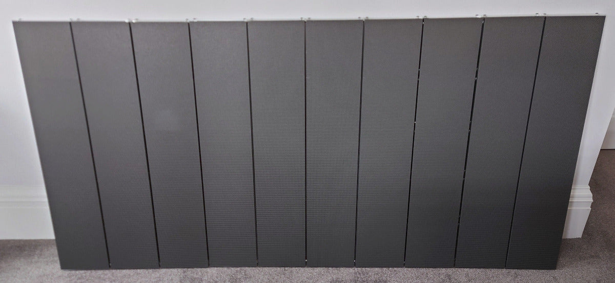 10 identical LED panels lined up in a row against a wall 