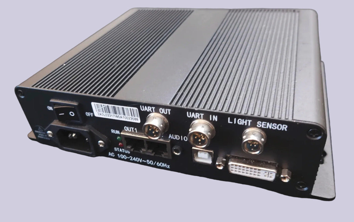 Back view of an electronic device with various ports and labels on a grey background