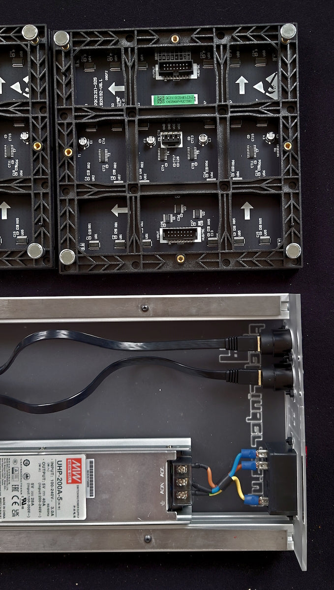 LED modules aligned correctly next to the frame. Note the arrow directions.