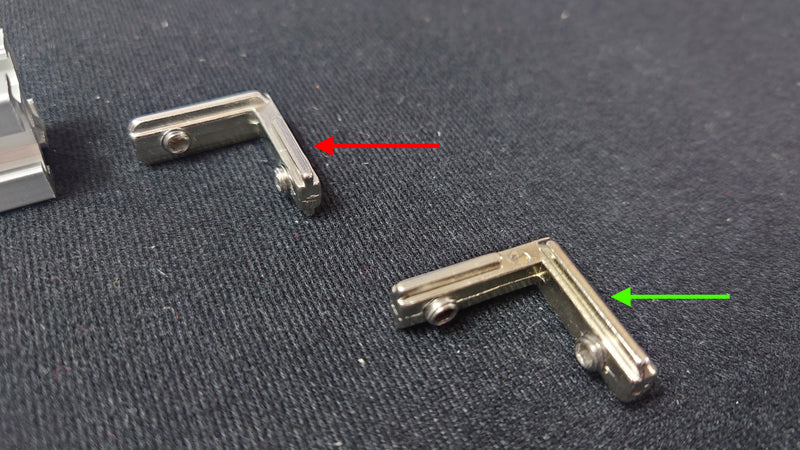 The green arrow shows the correct L-bracket alignment