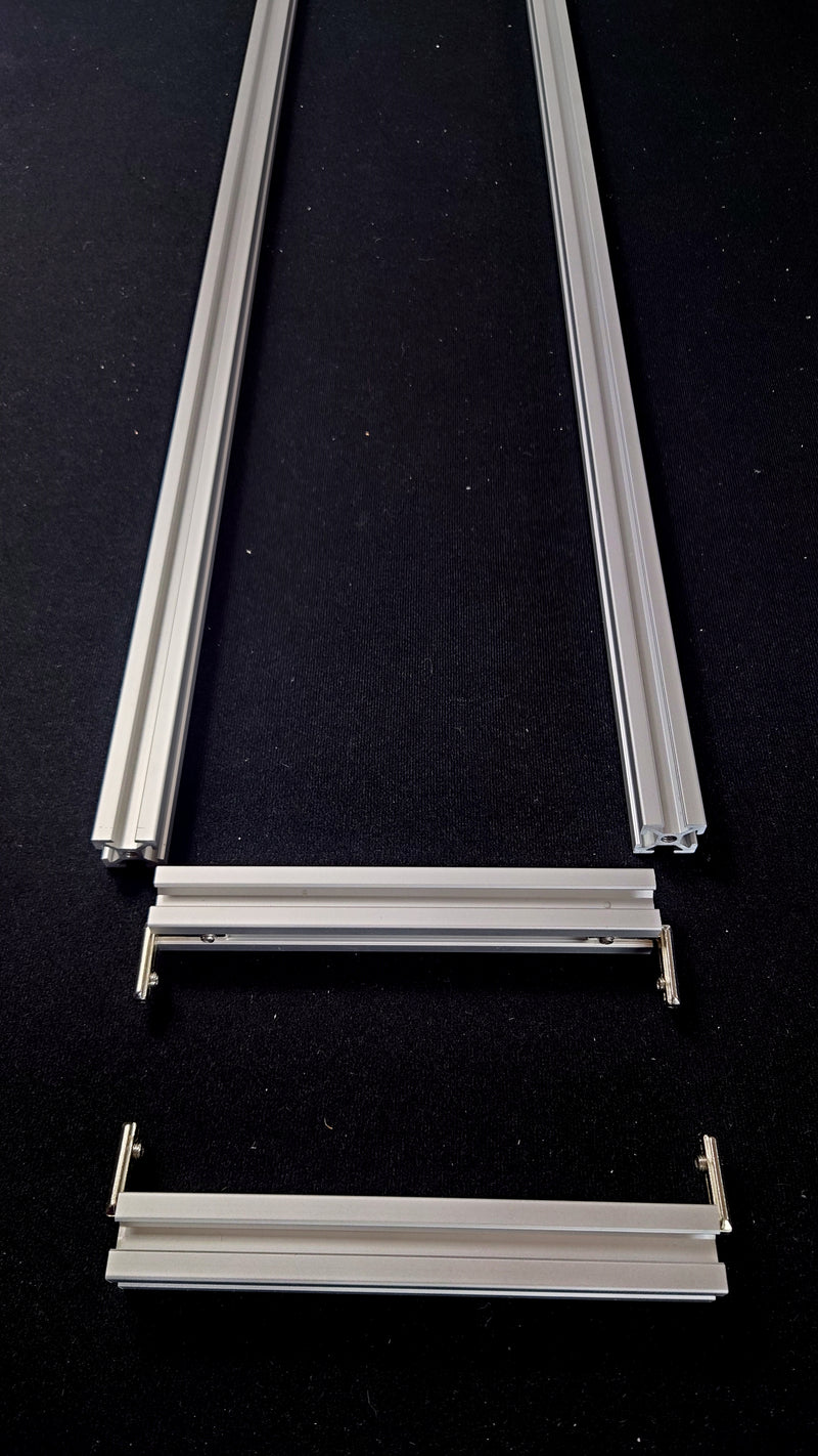 Align cross bars with side bars as shown. T-nuts are not shown in this image but should be facing upwards (see other step images)