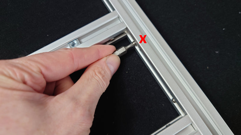Do NOT tighten the L-bracket onto the side bars yet!