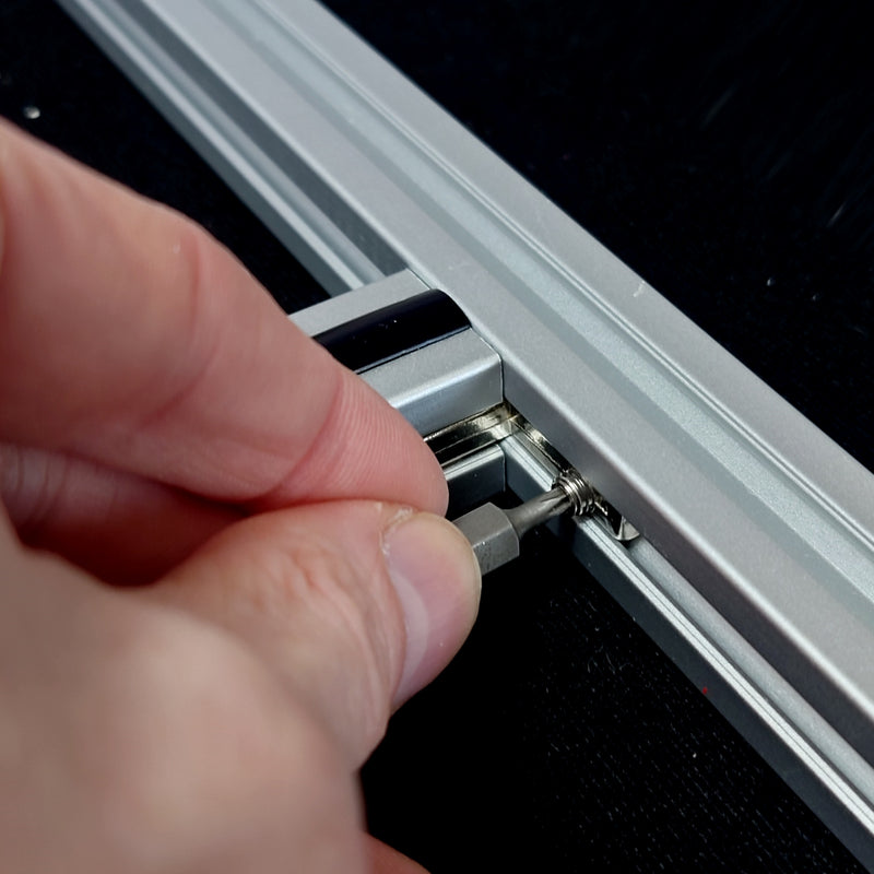 Tighten the L-bracket to the side bar once aligned