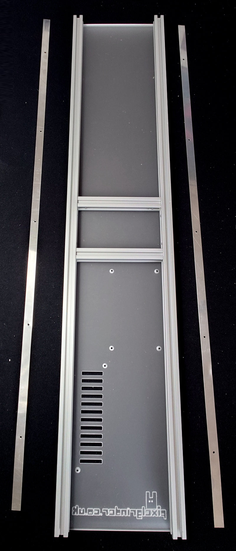 The stainless steel strips next to the frame