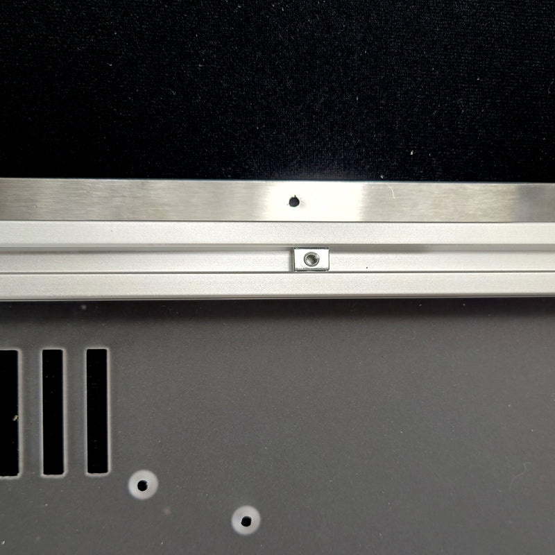 Align the T-nuts with the corresponding holes on the stainless steel strip
