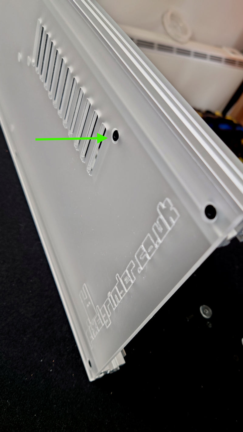 Push the screws into the holes from the back of the panel
