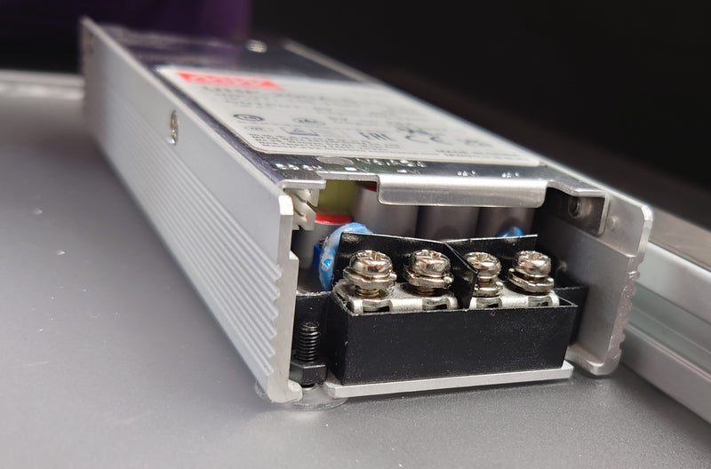 The PSU attached to the back plate with a securely tightened nut