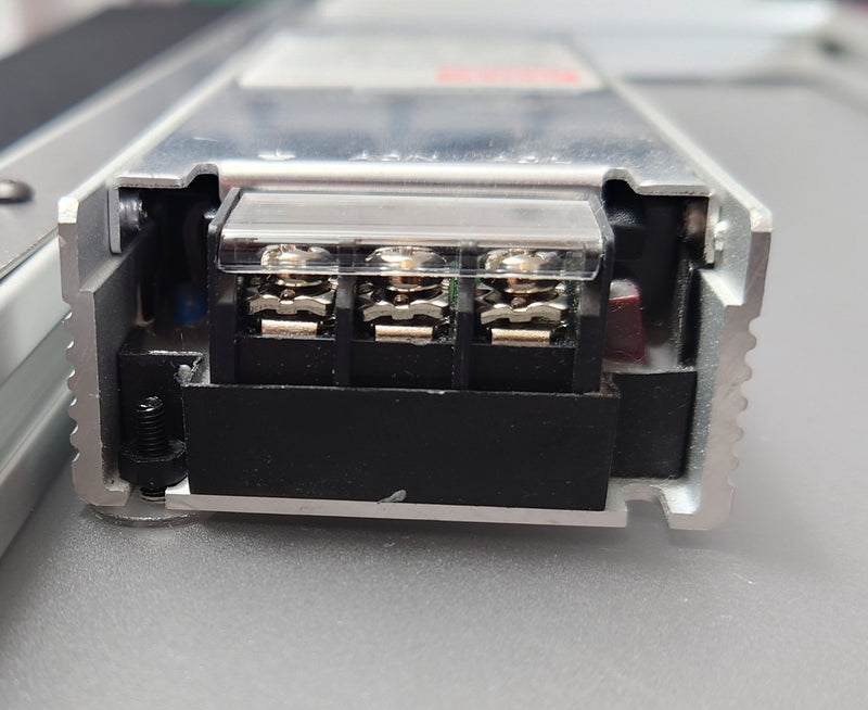 The PSU attached to the back plate with a securely tightened nut